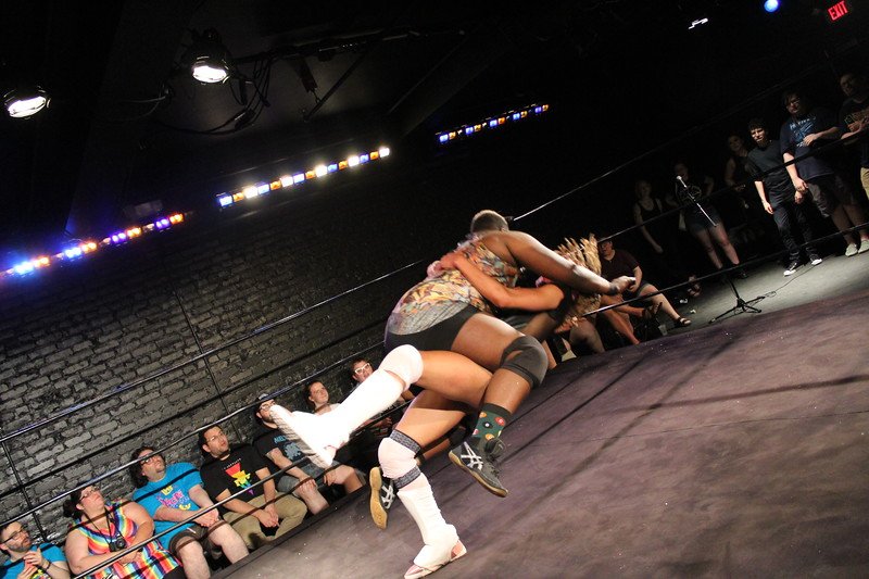 Two pro-wrestlers wrestling